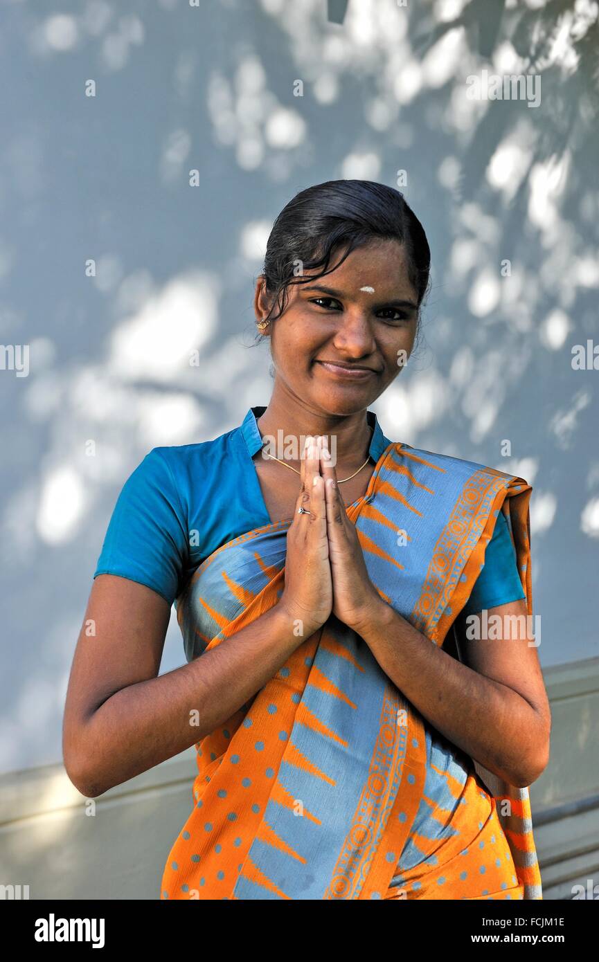greeting by a young hostess of 5 star Heritage Madurai Hotel, Madurai