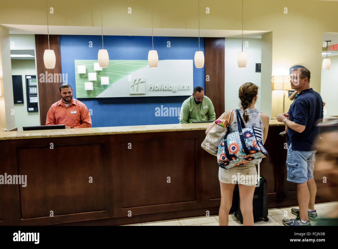 Florida,South,Orlando,Kissimmee,Holiday Inn,hotel hotels lodging inn motel motels,lodging,interior inside,lobby,front desk check in reception reservat Stock Photo