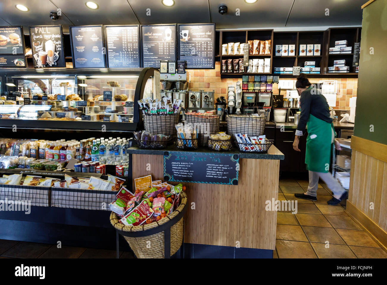 Orlando Kissimmee Orlando Florida Starbucks Coffee inside woman Stock