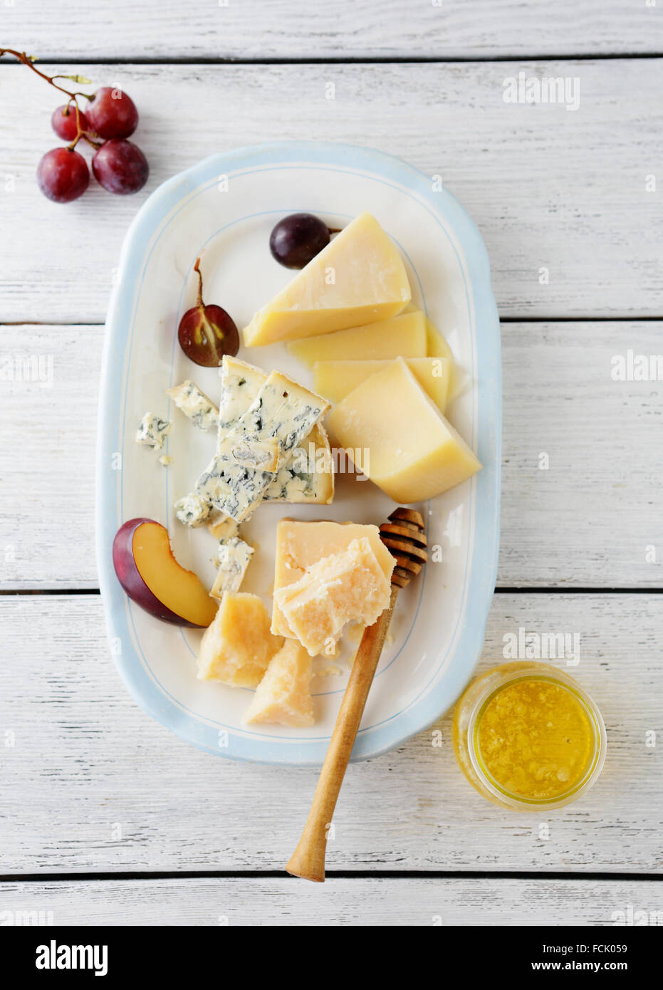 cheeses mix on old plate, food top view Stock Photo - Alamy