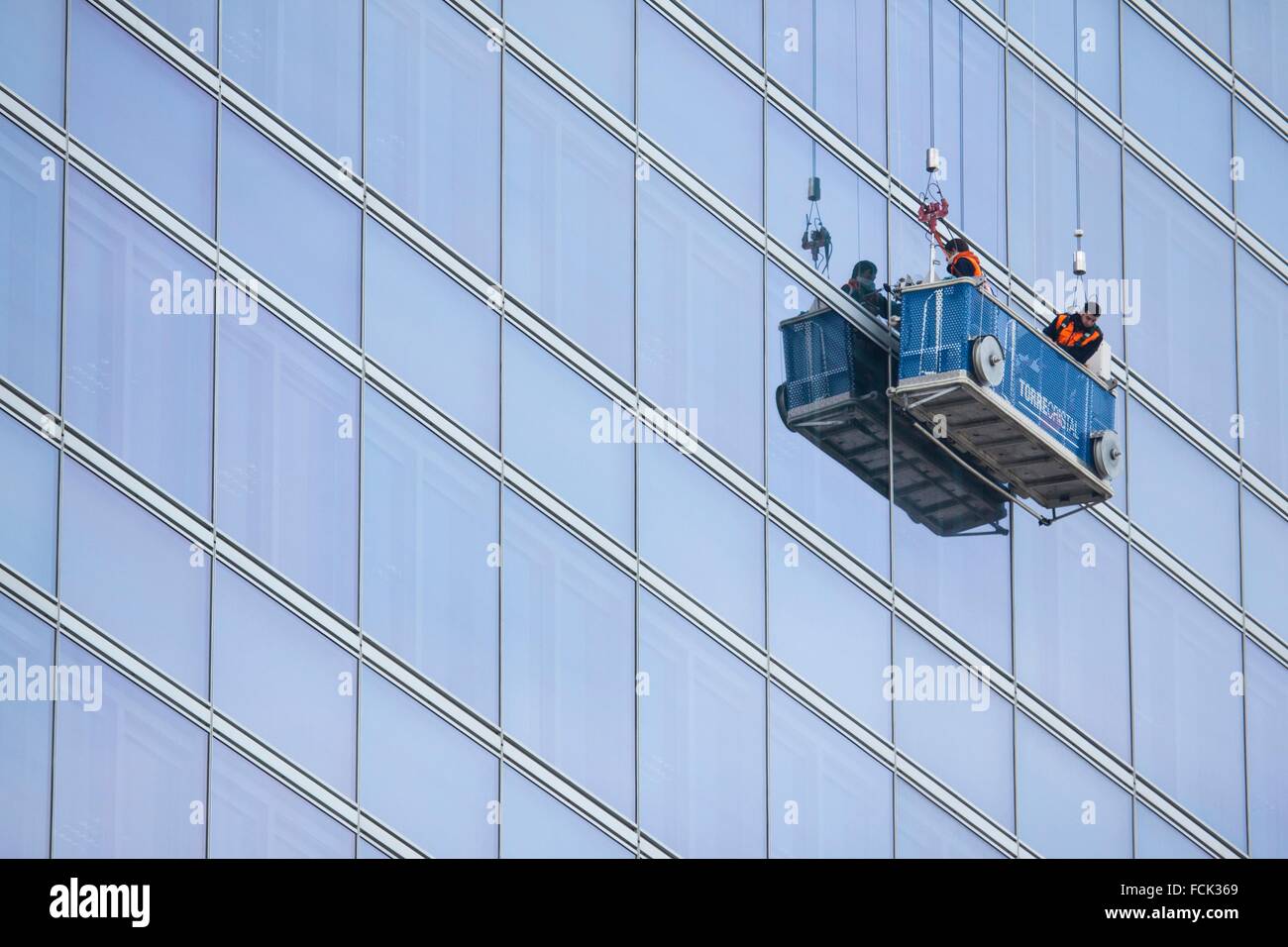 Window cleaner scaffold. Skyscraper. Cuatro Torres Business Area (Four