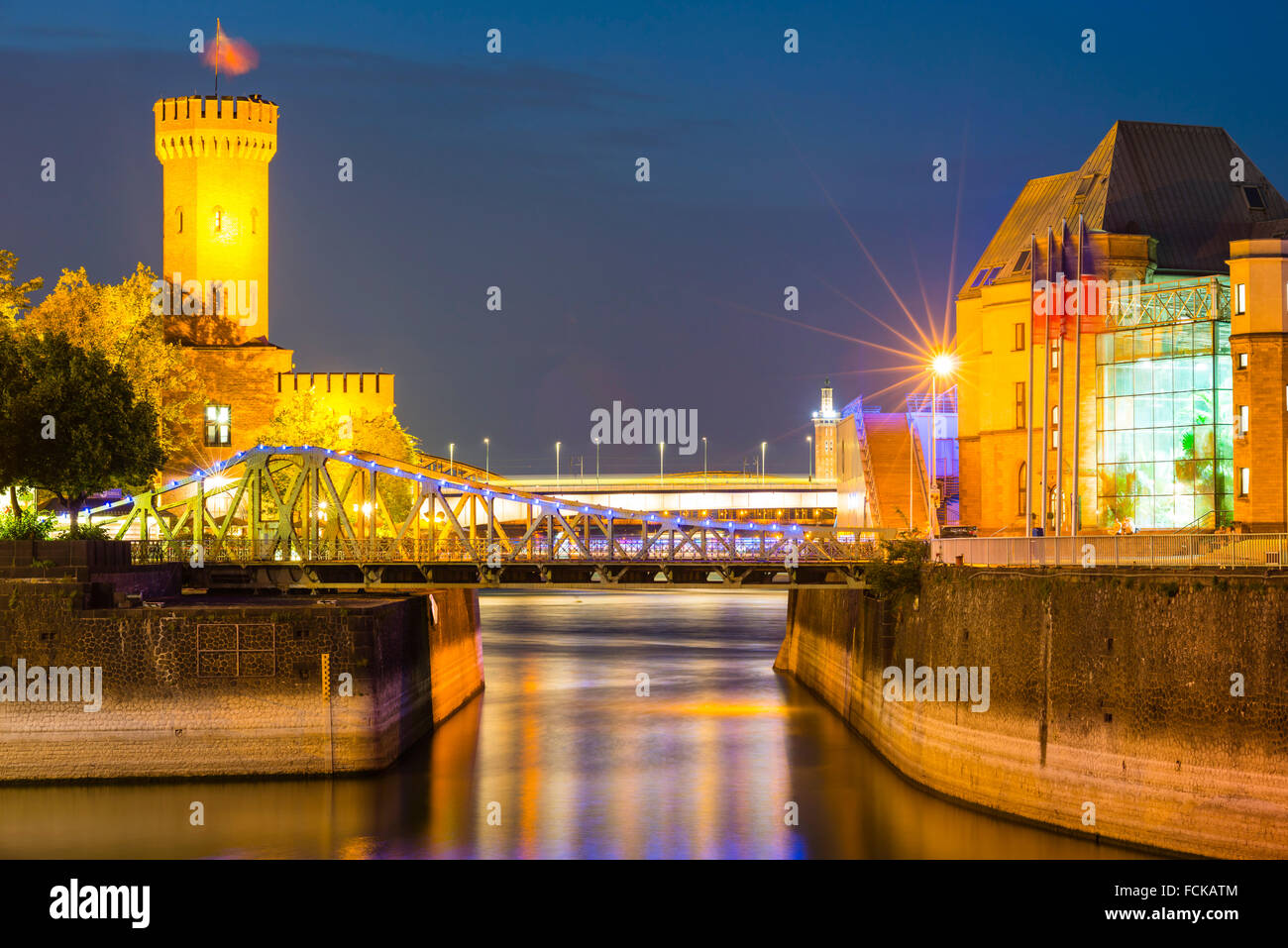 Germany Cologne Rheinauhafen Malakoff Tower and Imhoff chocolate museum at blue hour Stock Photo