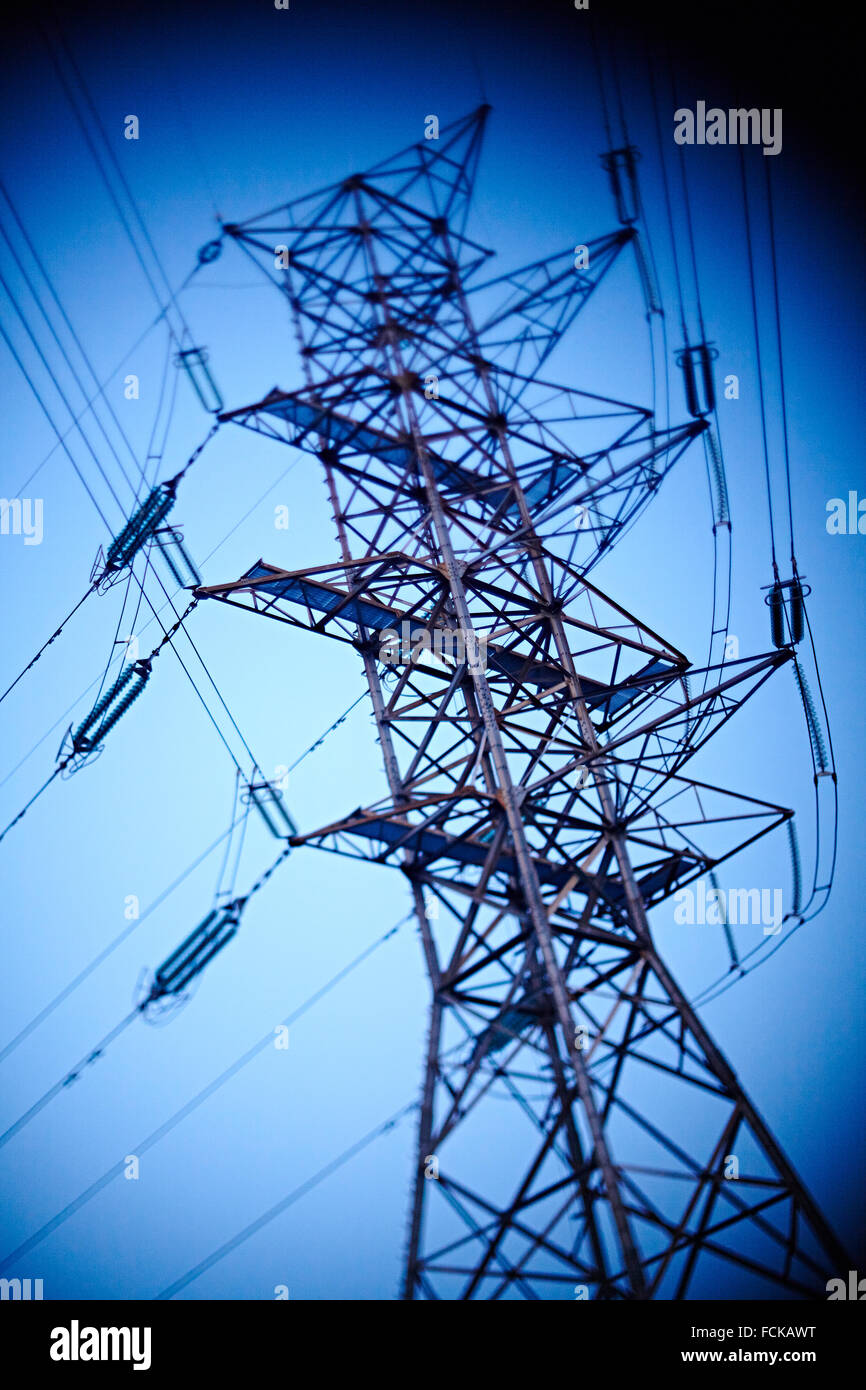 Power pylon in front of blue sky Stock Photo - Alamy