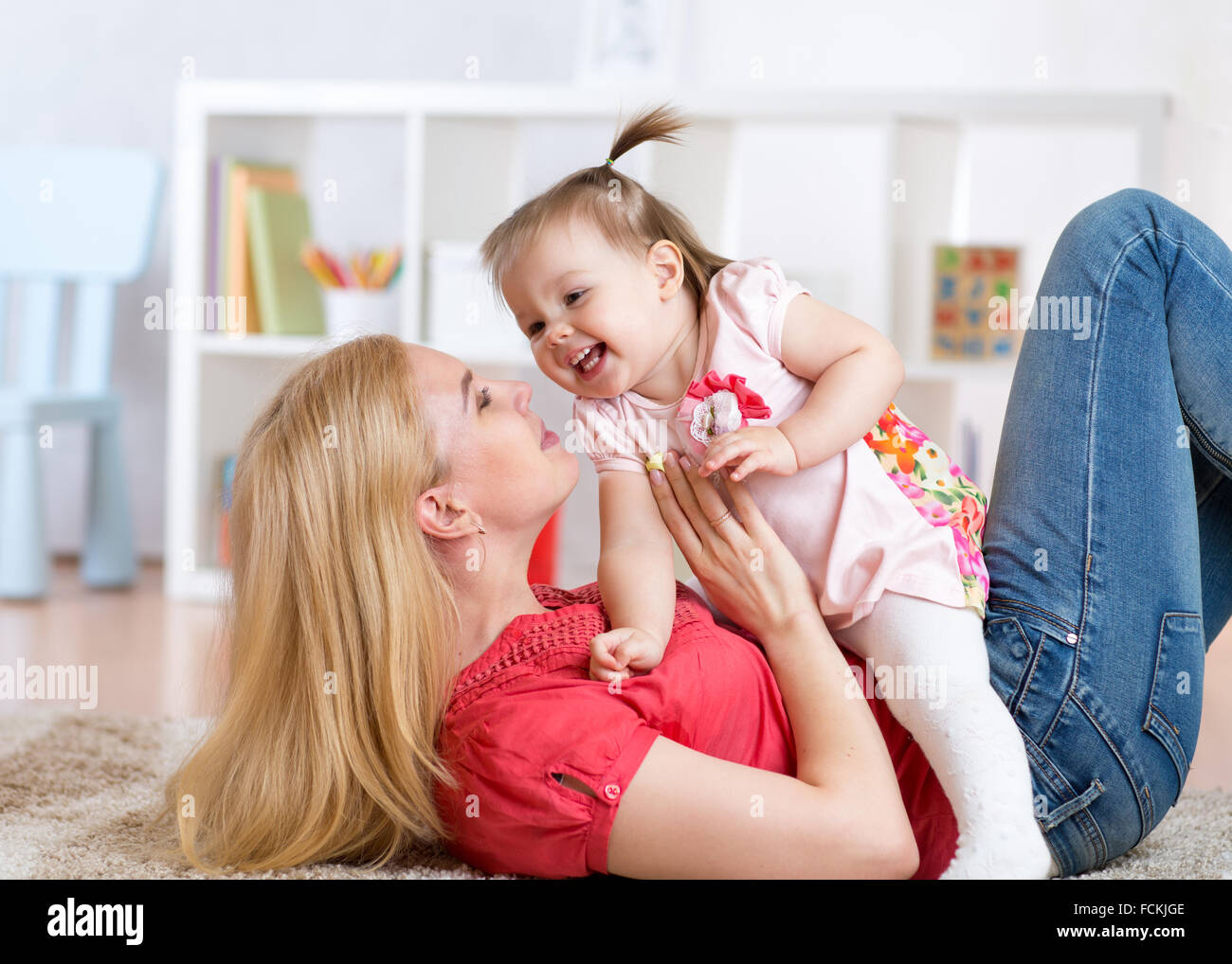 young mother with her baby having fun pastime Stock Photo