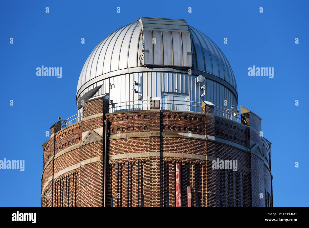 Lund, Sweden - January 21, 2016: The top part of the southern astronomy observation tower in Lund against a blue sky. The metal Stock Photo