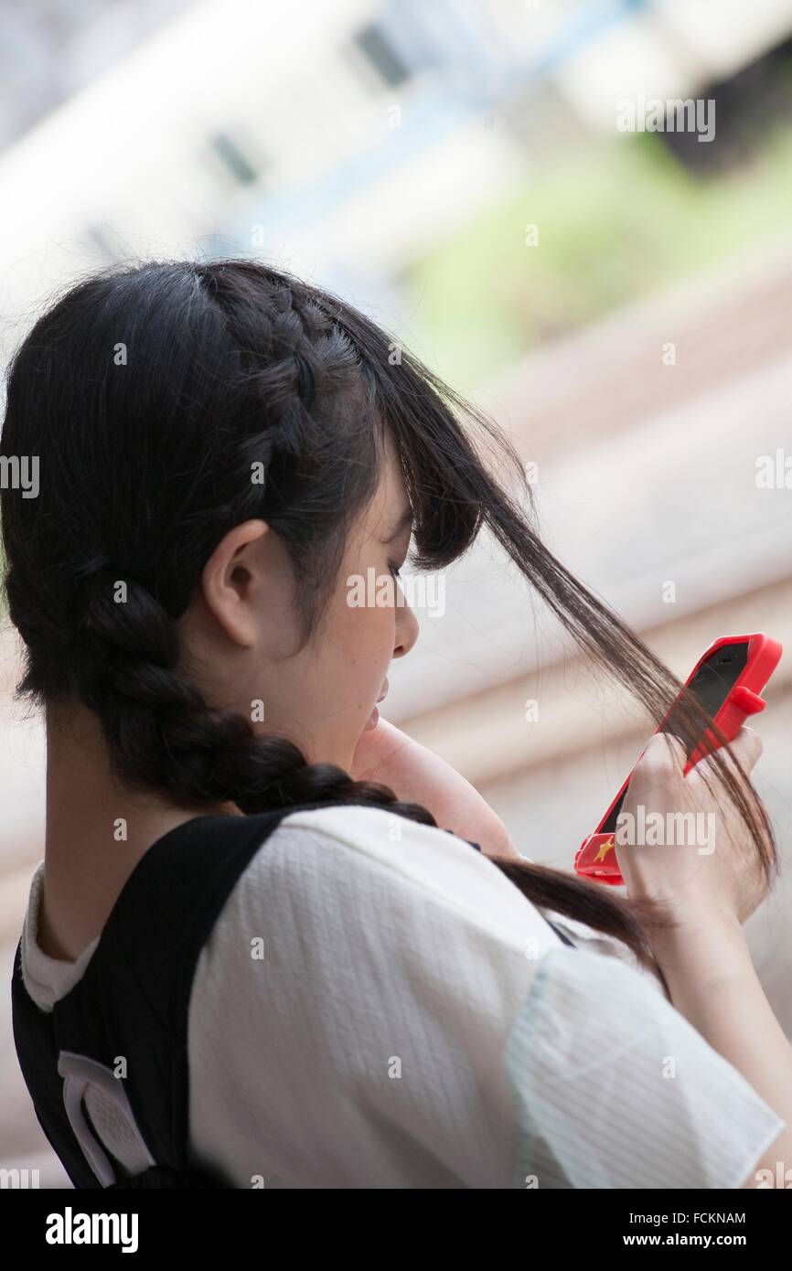 Japanese girl with phone Stock Photo