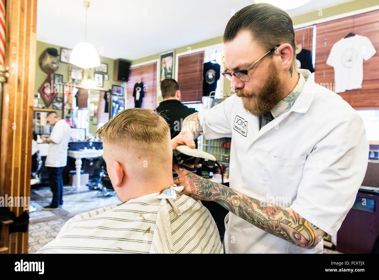 Rotterdam, Netherlands. Barber store Schorem. Barber helping his customer in his barber shop by cutting and modeling his hair Stock Photo - Alamy