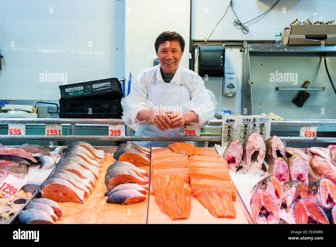 New York USA Chinese man working on the Fish Department of a Chinese 