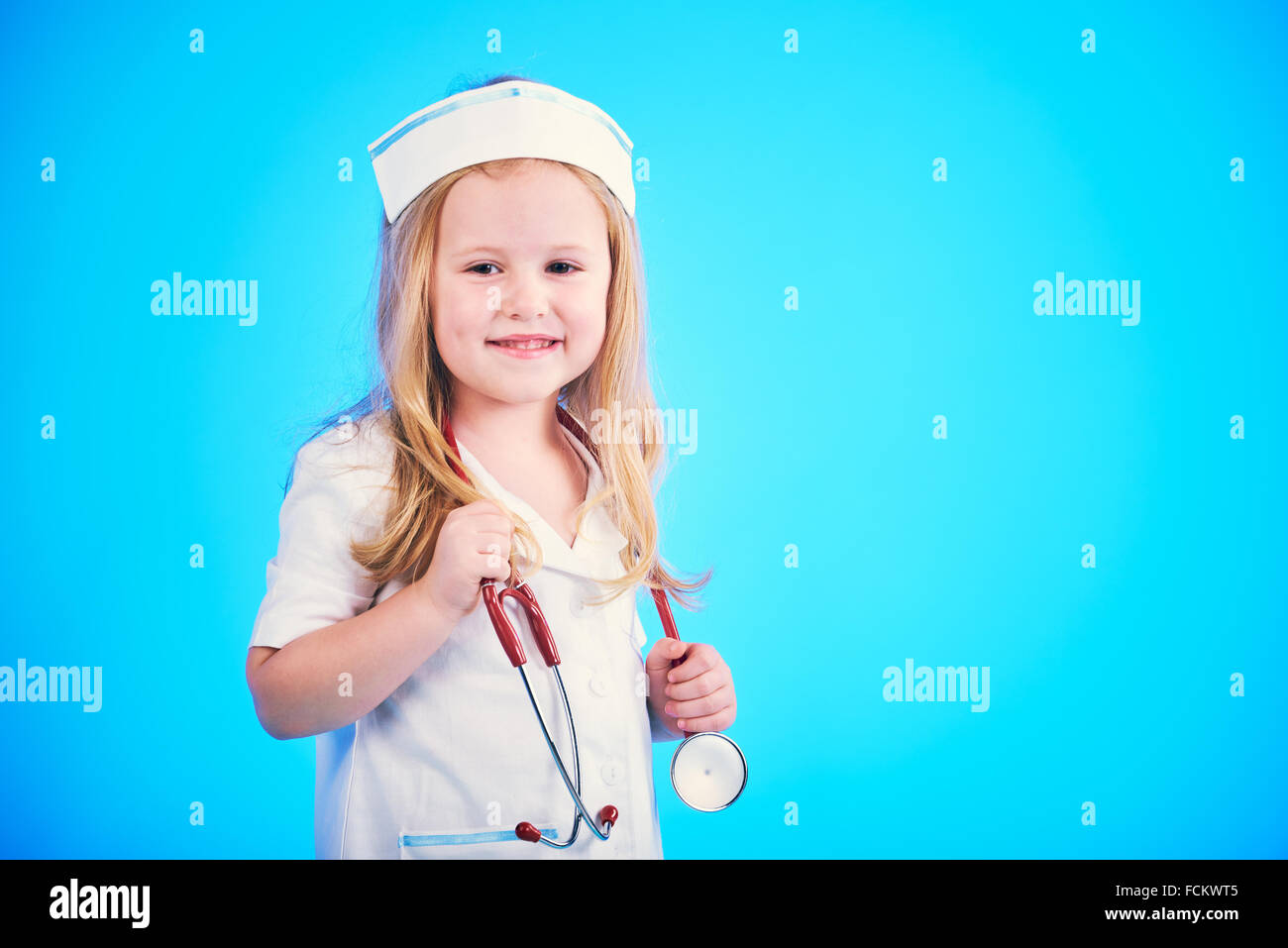 Young attractive nurde with stethoscope and headphones and microphone.  Isolated on white Stock Photo - Alamy