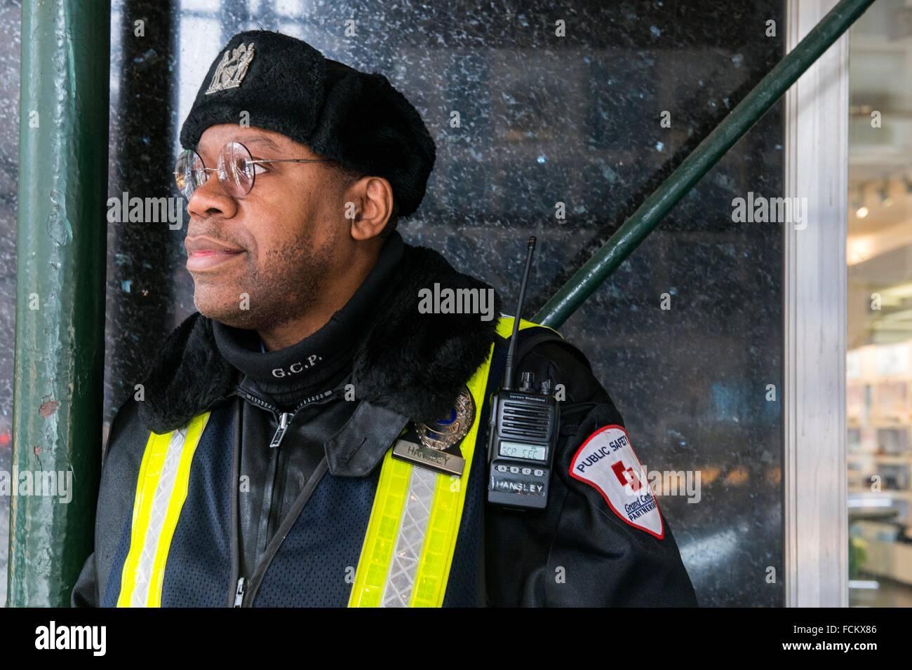 New York, USA. African American security guard on the lookout at Grand