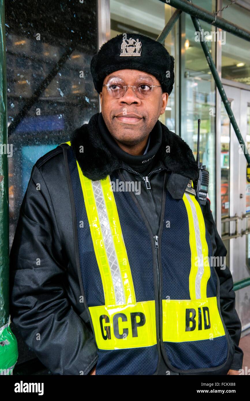 New York, USA. African American security guard on the lookout at Grand