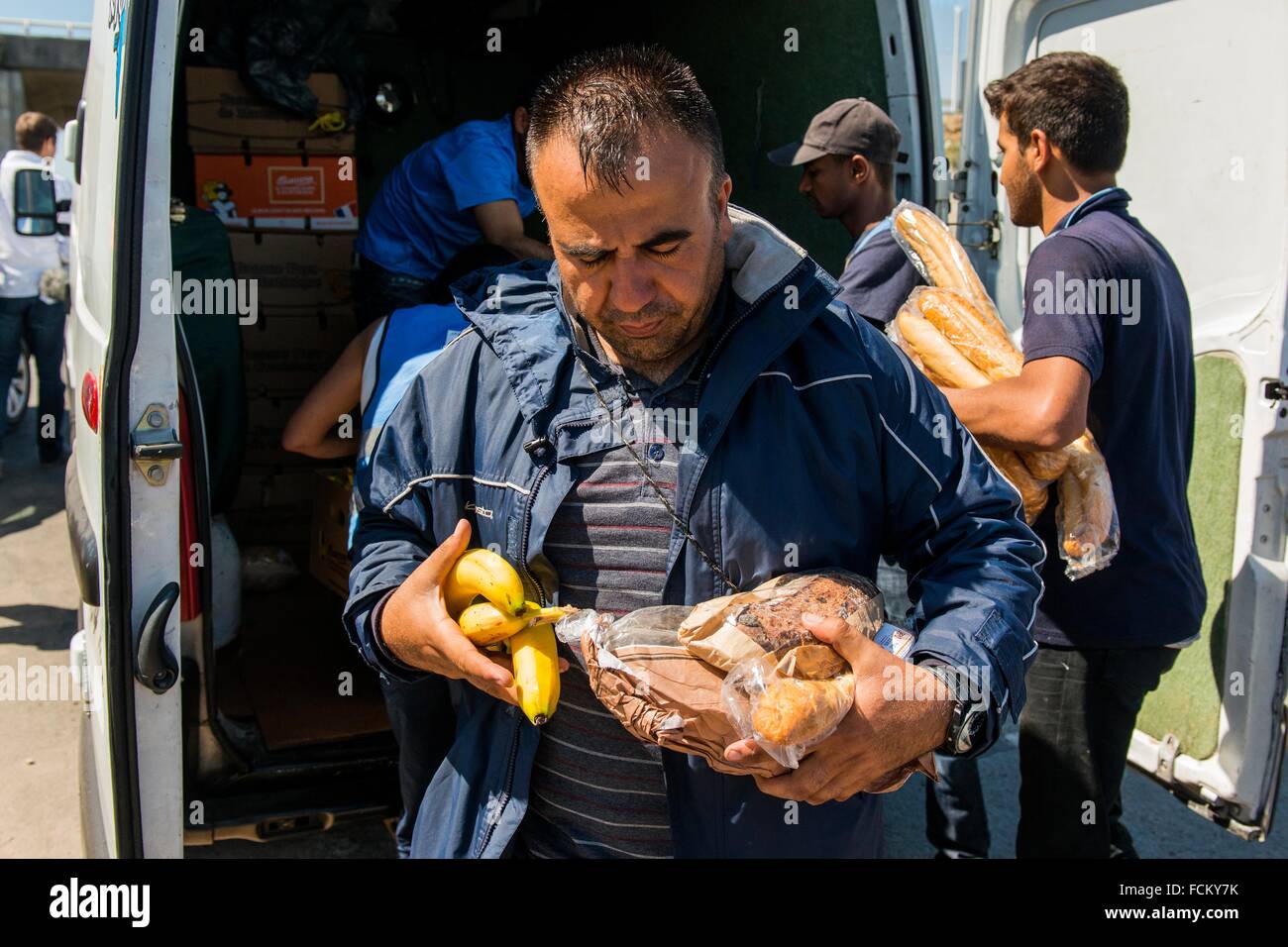 The Jungle, Calais, France. Daily distribution of food, donated by the