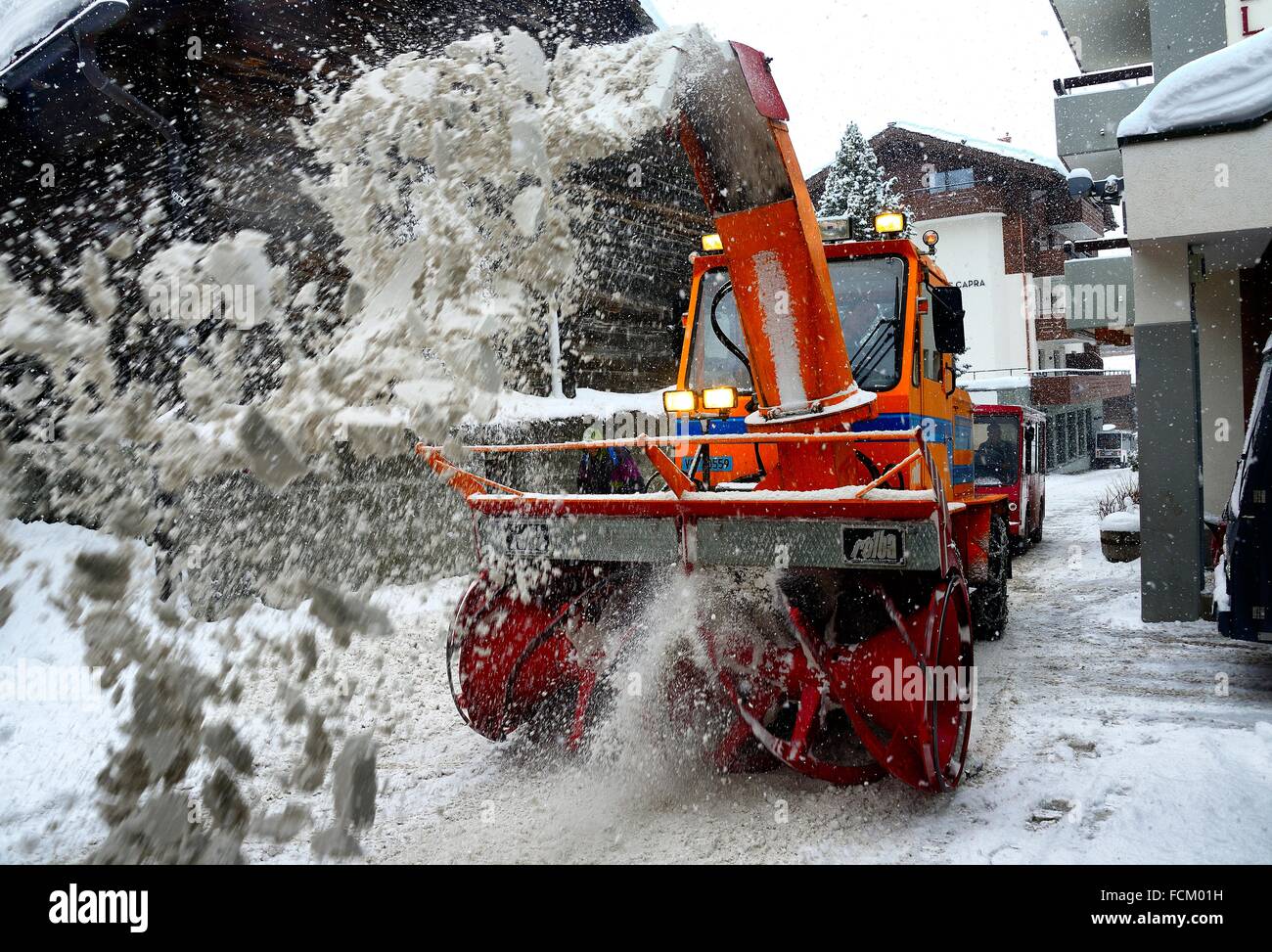 Snow removal from street of Swiss ski resort SaasFee in heavy