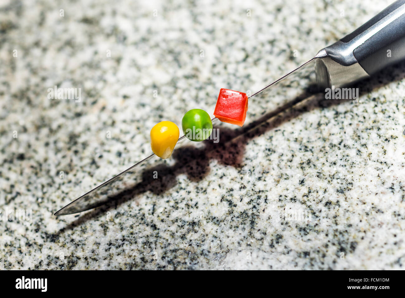 cutting on a knife, metal, steel, stainless steel, kitchen utensil