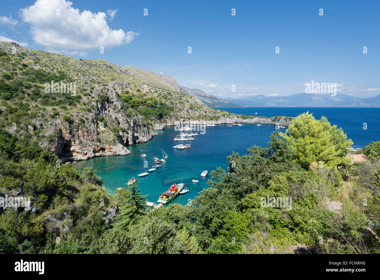 Vessels moored in the bay Baia degli Infreschi on the Masseta coast of Cilento in Italy in summer Stock Photo