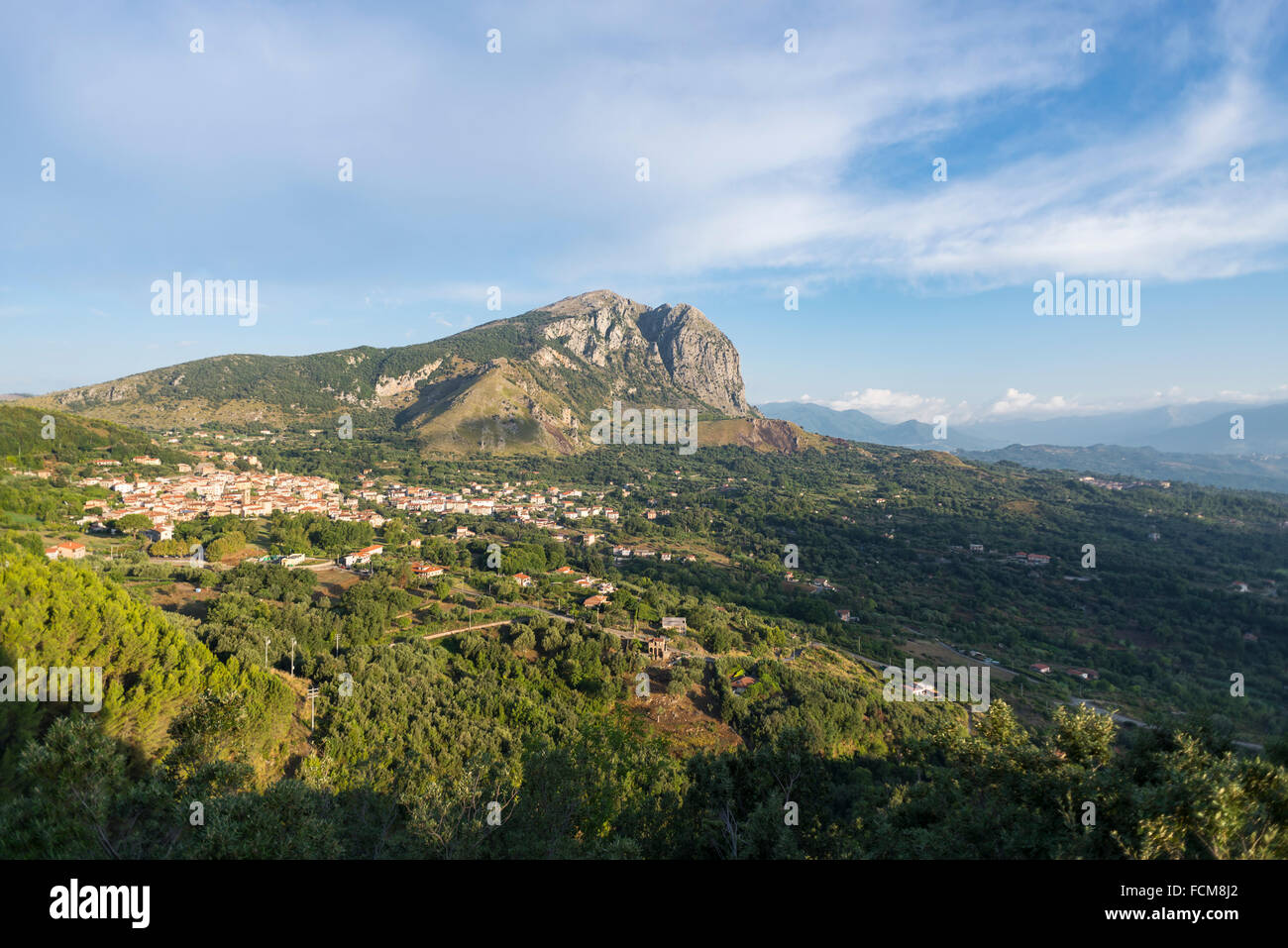 The mountain range of Monte Bulgheria and the township of San Giovanni a Piro in Cilento in the morning sun Stock Photo