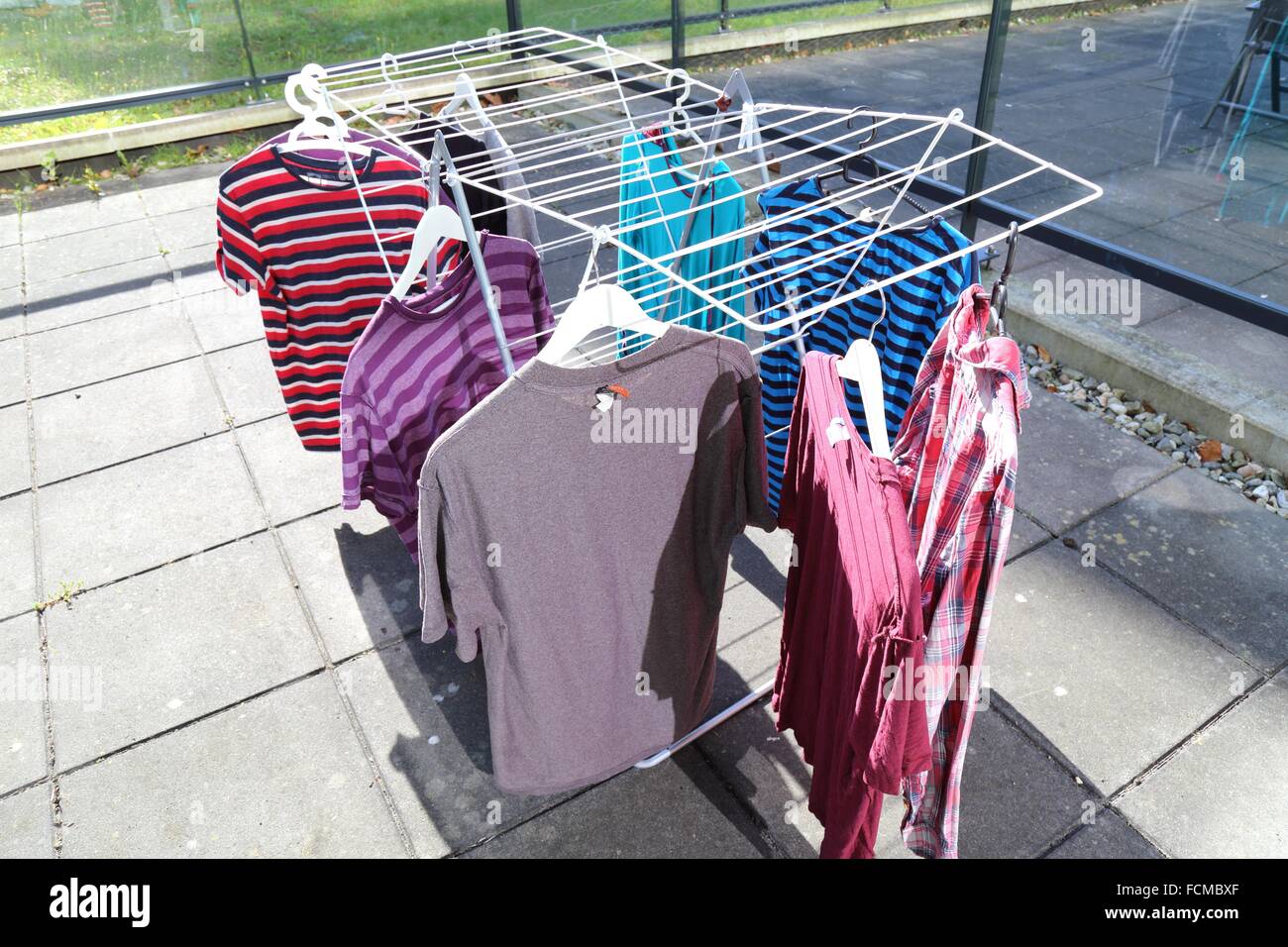 Colorful shirts drying in the open air Stock Photo Alamy