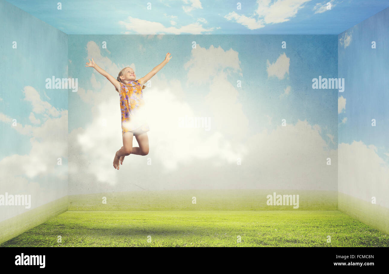 Little cute happy girl jumping high in sky Stock Photo - Alamy