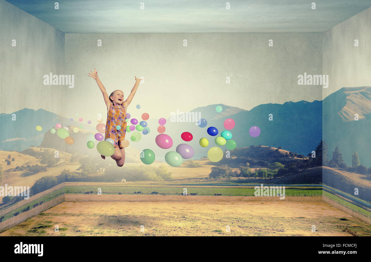 Little cute girl jumping high among balloons flying in sky Stock Photo ...