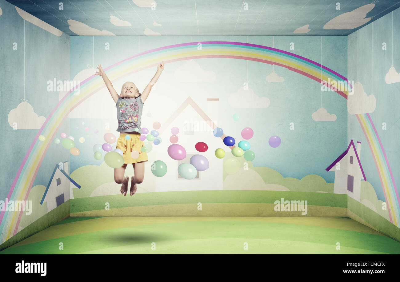 Little cute girl jumping high among balloons flying in sky Stock Photo ...