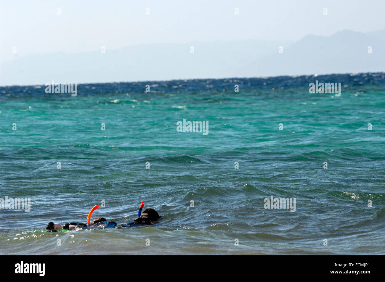 Mother and daughter go snorkeling in the Red Sea at Aqaba, Jordan Stock