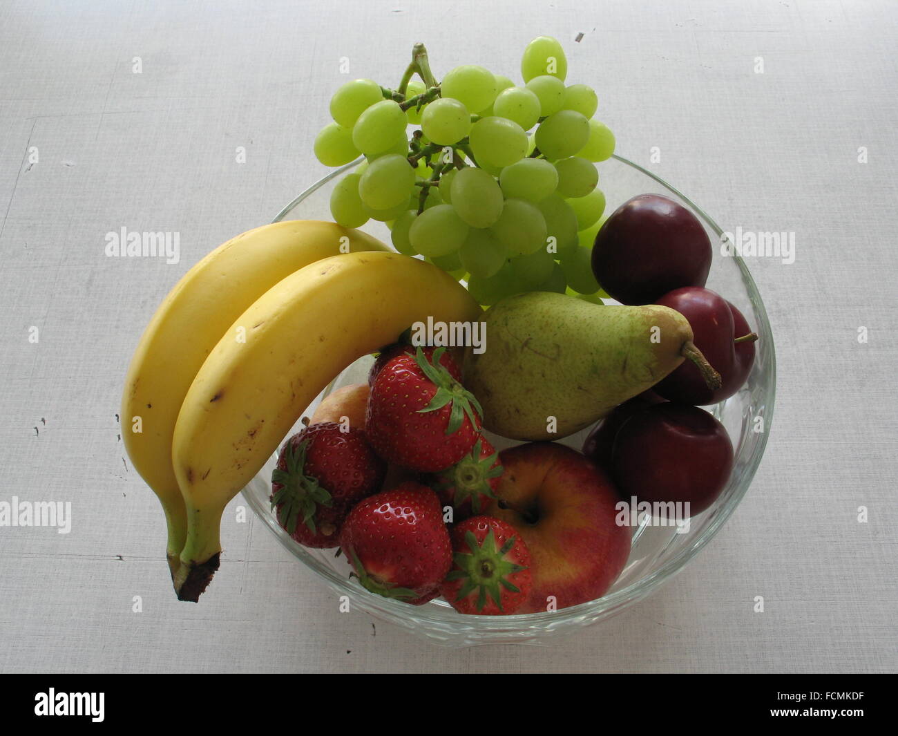 dish with fruits on a table Stock Photo