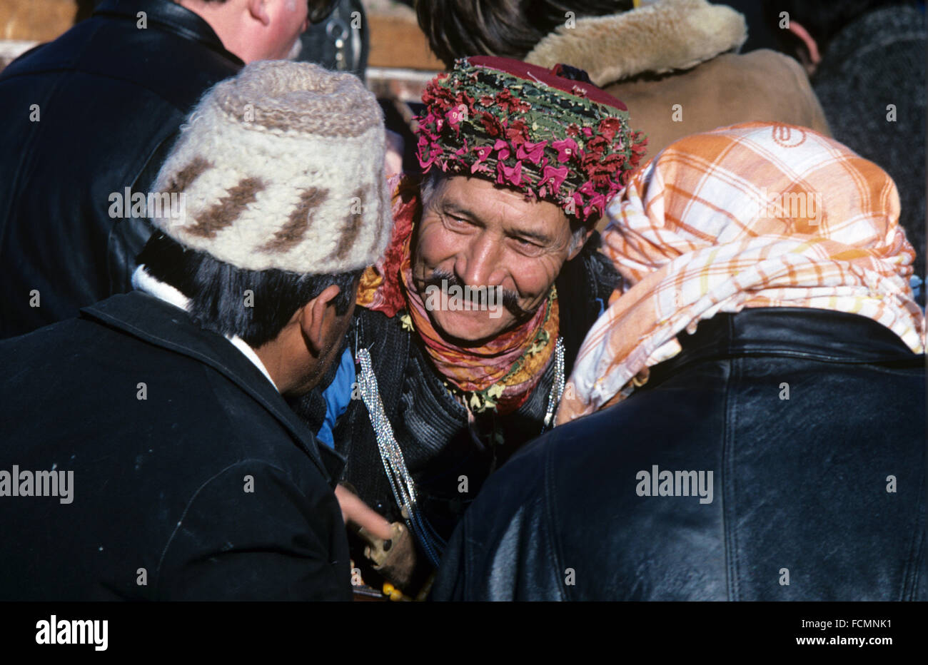 Three Turkish Men Wearing Traditional Turkish Dress, including (in center) Traditional Aegean Military Costume,known as Zeybek and Head Wear in Conversation at the Annual Camel Wrestling Championship, Ephesus, turkey Stock Photo