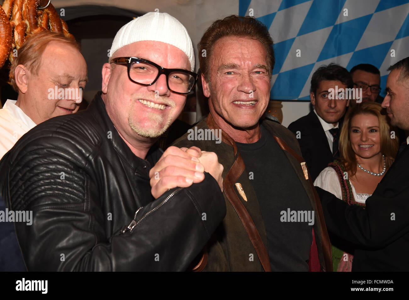 Actor Arnold Schwarzenegger (r) and DJ Oetzi, Gerry Friedle, posing at the 25th Weisswurst party at Stanglwirt hotel in Going, Austria, 22 January 2016. Photo: Felix Hoerhager/dpa Stock Photo