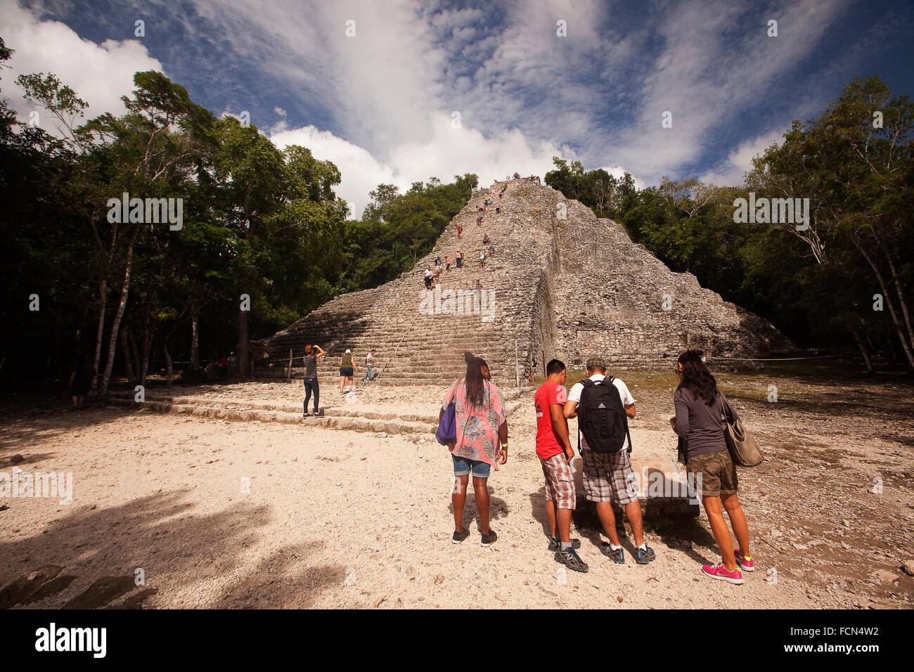 Tourists climbing up to the Nohoch Mul Pyramid at the Prehispanic Mayan