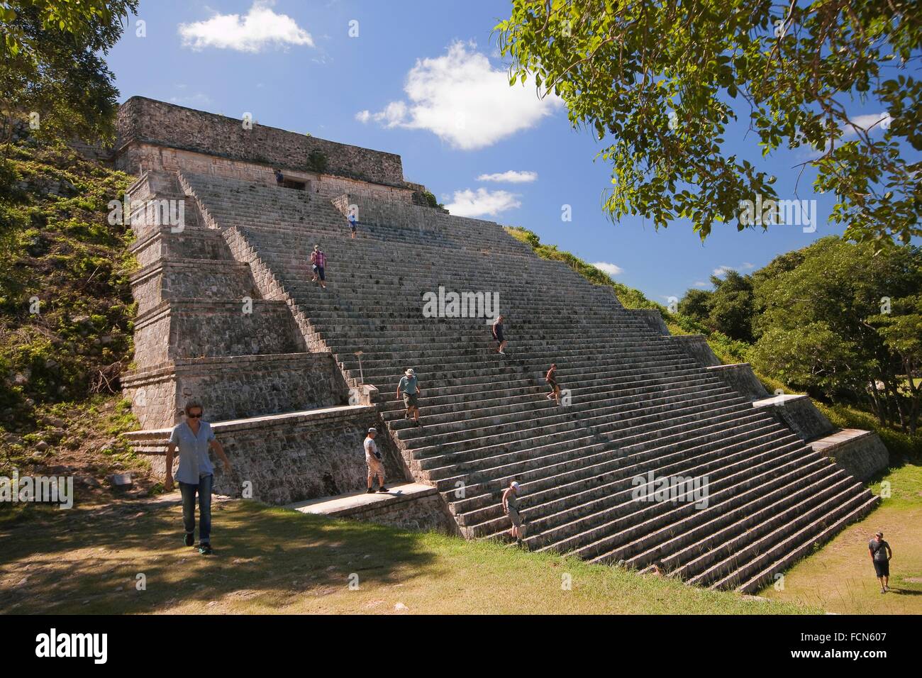 Tourists climbing up and down the steps of The Great PyramidGran