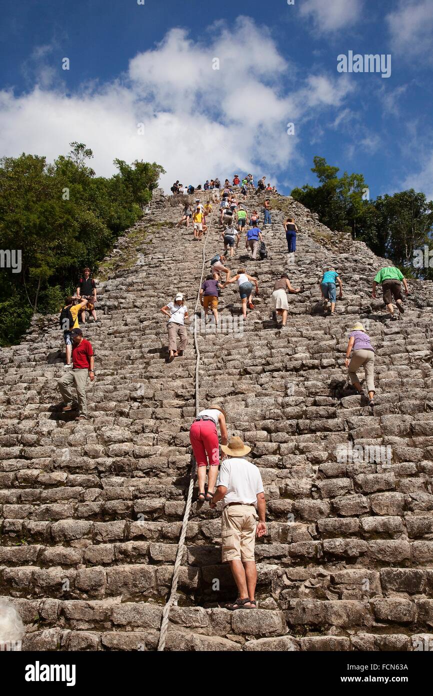 Tourists climbing up to the Nohoch Mul Pyramid at the Prehispanic Mayan