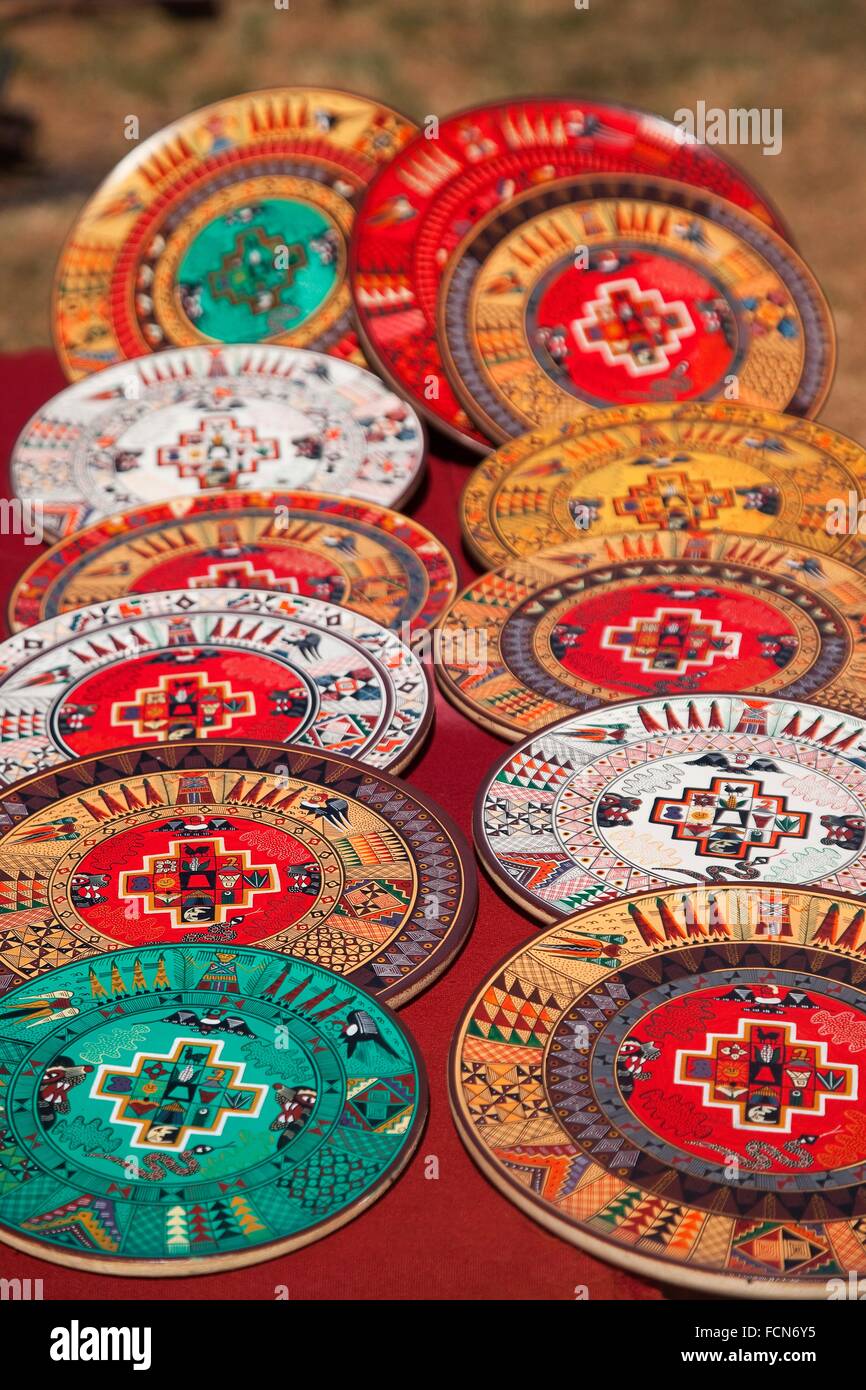 Closeup shot of wooden bowls and plates at the openair market in