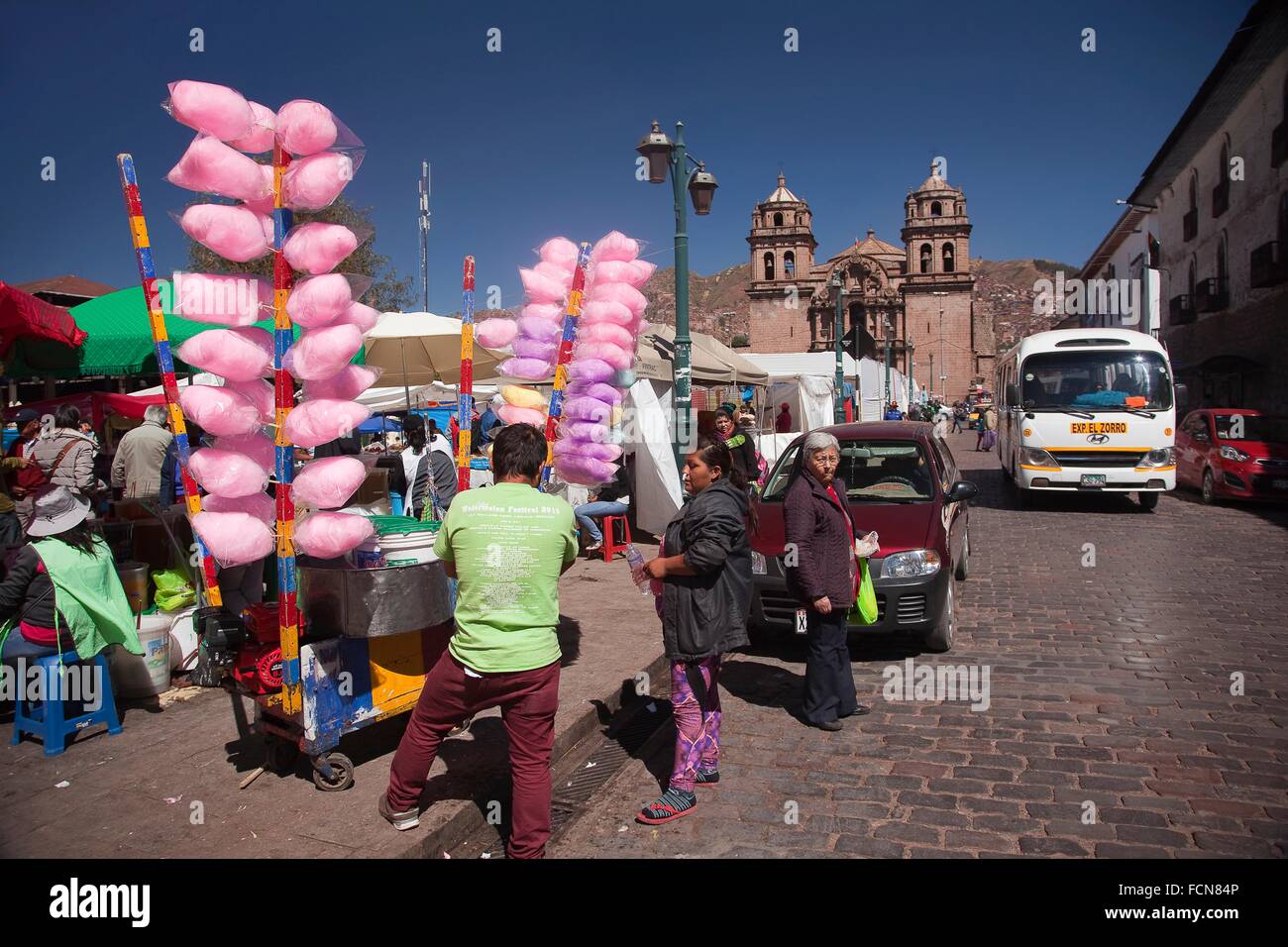 Vendor selling cotton candy at the street near the market place with