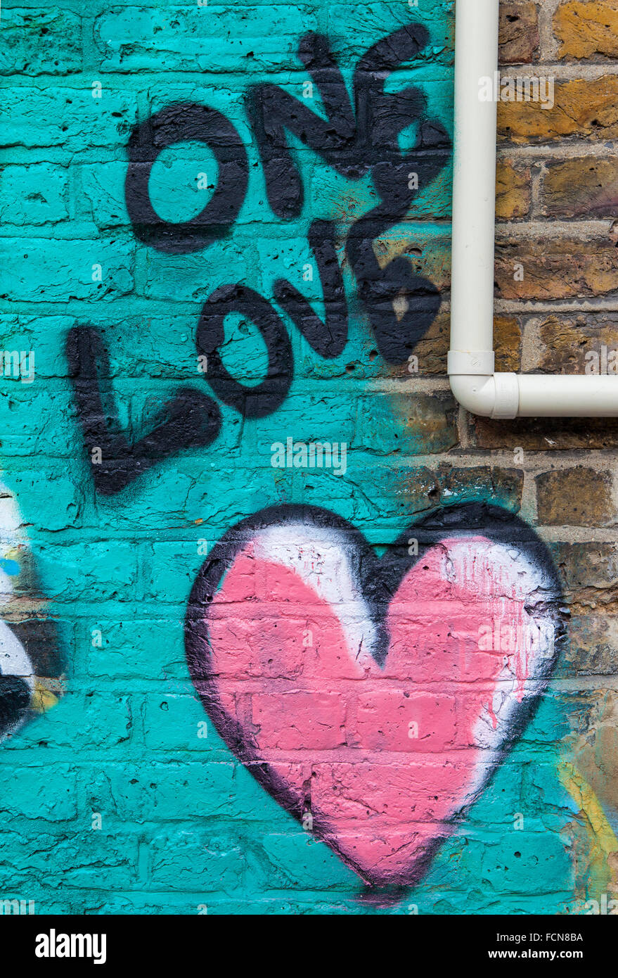 LONDON, UK - JANUARY 13TH 2016: An abstract piece of graffiti on a brick wall symbolising love, on 13th January 2016. Stock Photo