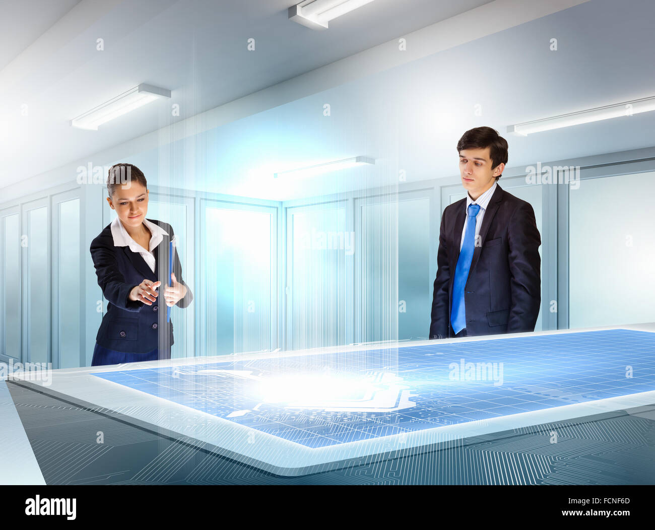young businesspeople clicking on icon of high-tech image Stock Photo