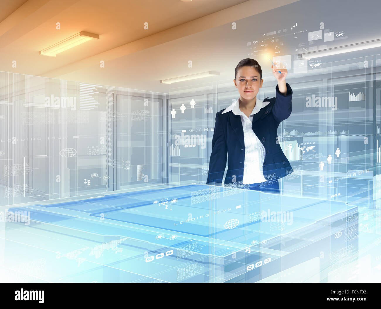 Image of young businesswoman clicking icon on high-tech picture Stock Photo