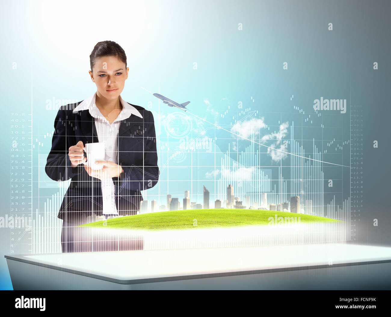 Image of young businesswoman holding cup standing against high-tech picture Stock Photo