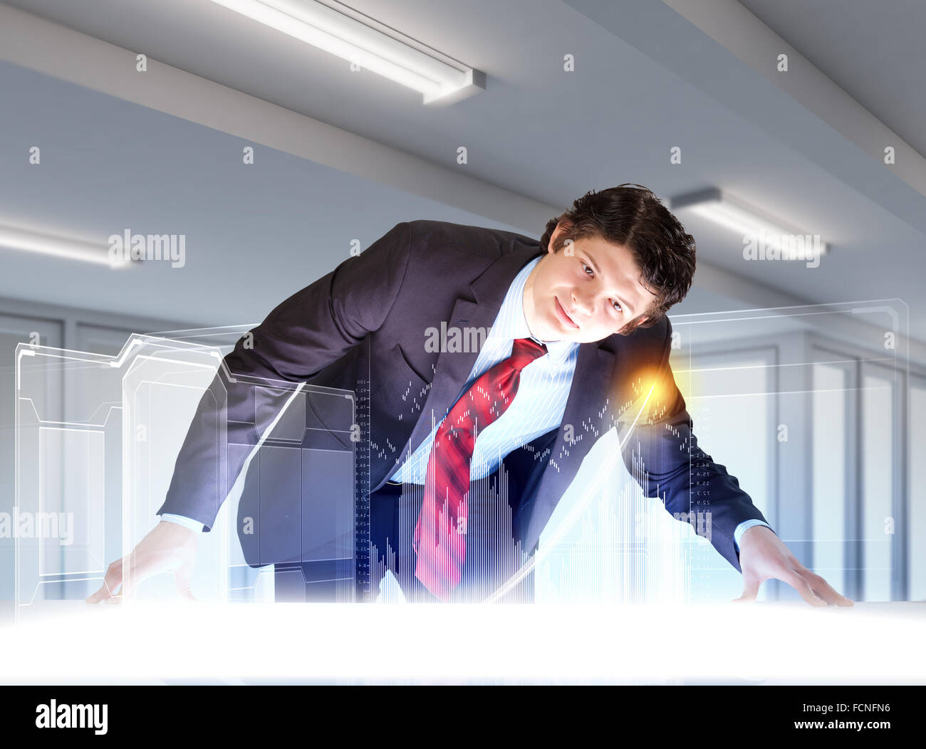 Image of young businessman looking at high-tech picture Stock Photo