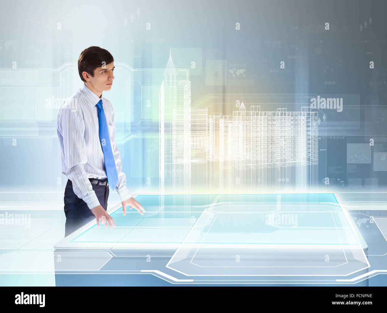 young businessman looking at high-tech image of building model Stock ...
