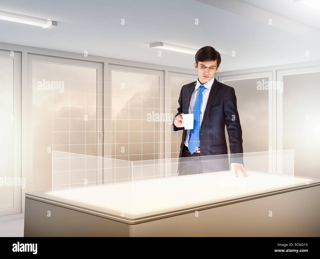 young businessman standing in background of high-tech image Stock Photo