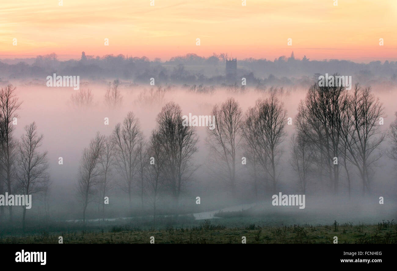 Mist over the Dedham Vale, with River Stour and Dedham Church, Suffolk, Constable Country, at sunset, winter. Stock Photo