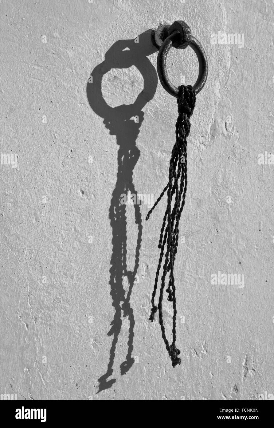 Old horse ring on the whitewashing wall Stock Photo