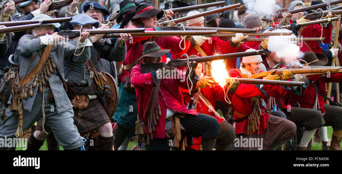 Black powder gunfire shoot in Nantwich, Cheshire, UK. 23rd Jan, 2016. Siege of Nantwich battle re-enactment.  For over 40 years the faithful troops of The Sealed Knot society members have gathered in the historic town for a spectacular reenactment of the bloody battle that took place almost 400 years ago and marked the end of the long and painful siege of the town.  Roundheads, cavaliers, and other historic entertainers converged upon the town centre to re-enact the Battle. The siege in January 1644 was one of the key conflicts of the English Civil War. Stock Photo
