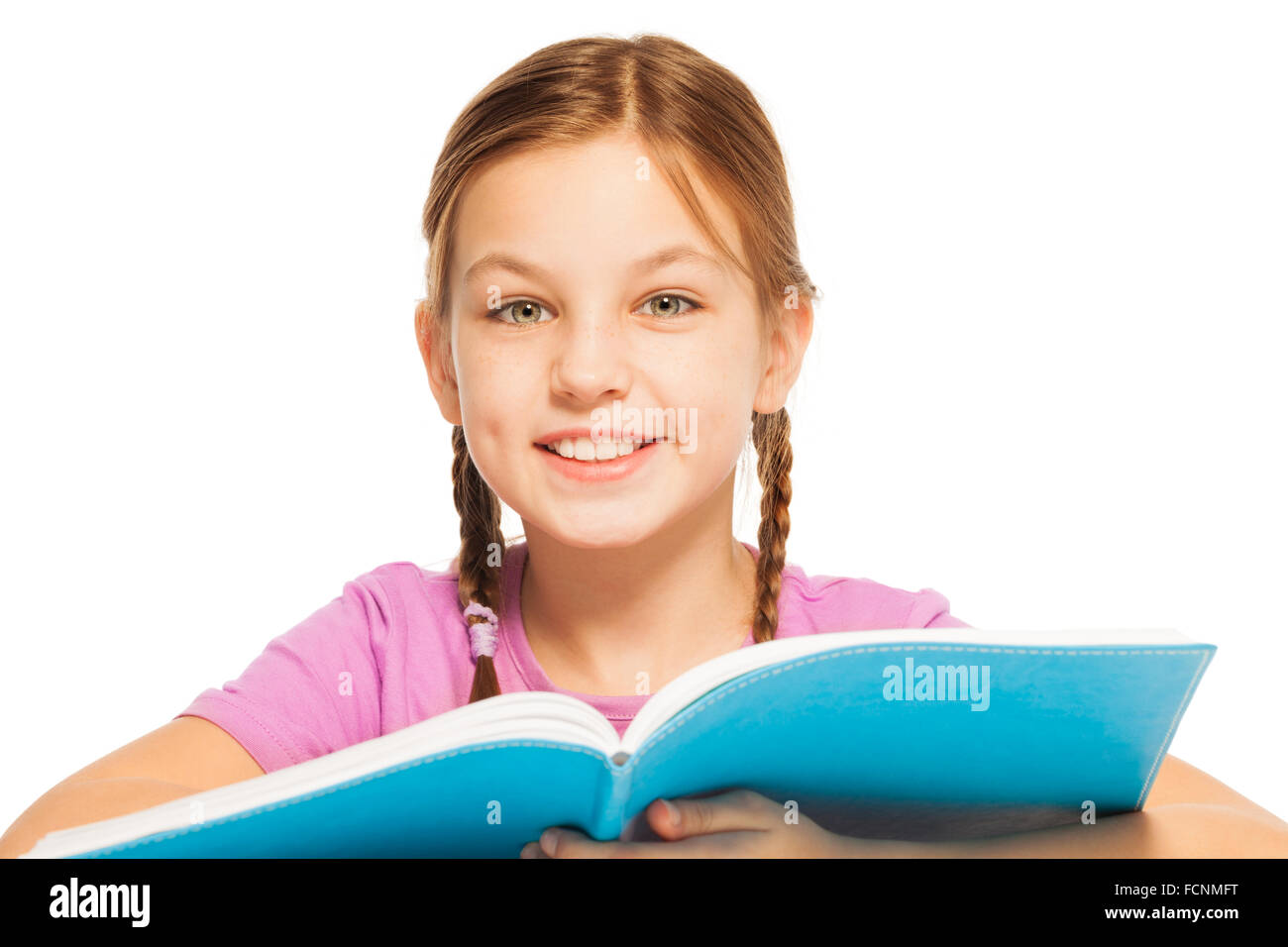 Clever smiling schoolgirl with a textbook Stock Photo - Alamy