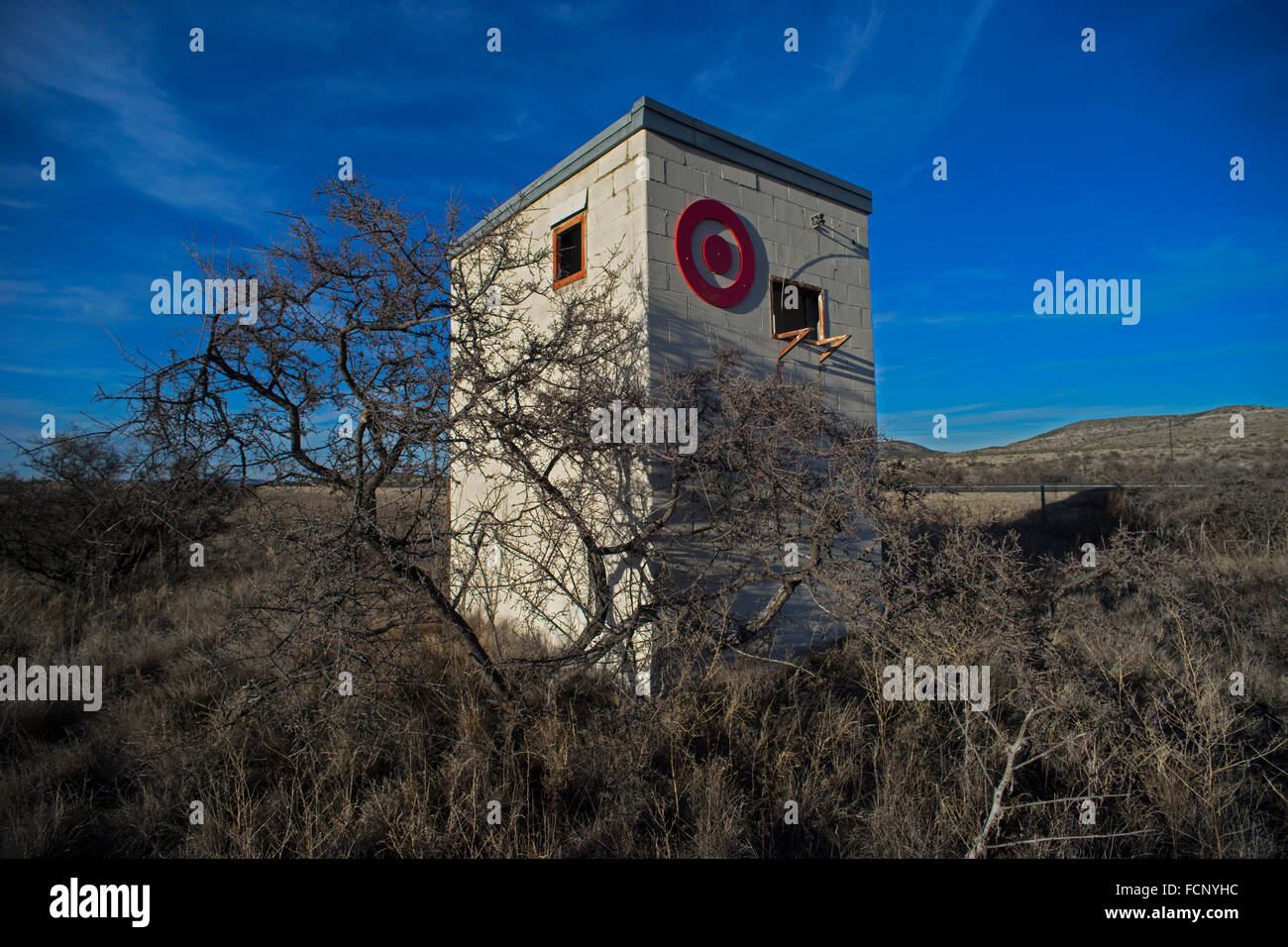 An artist transformed an abandoned building into an art installation by adding Target store chain name and logo in Marathon, TX. Stock Photo