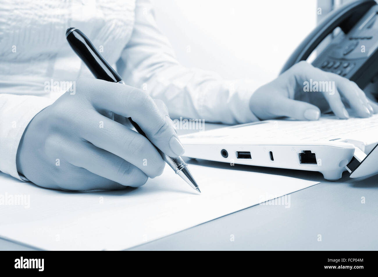 Hands of a young girl running on a computer in the office Stock Photo ...