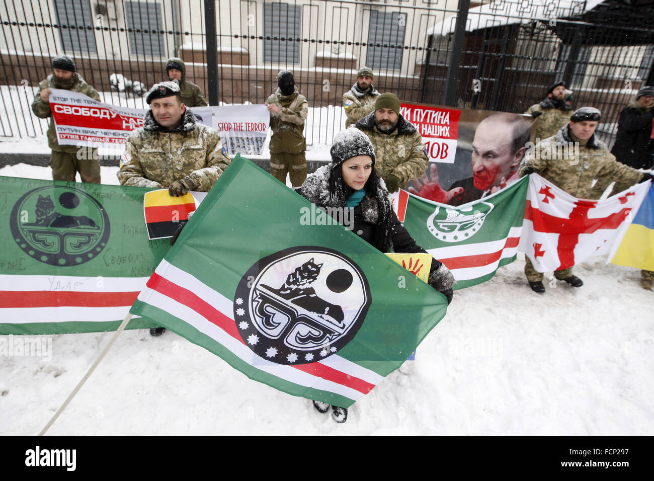 Kiev, Ukraine. 23rd Jan, 2016. Activists from Ukrainian voluntary battalions 'Georgia national legion' Chechen battalion named of Dzhokhar Dudayev, and their supporters during protest against the politics of Russian President Vladimir Putin, in front the Russian Embassy. © Vasyl Shevchenko/Pacific Press/Alamy Live News Stock Photo