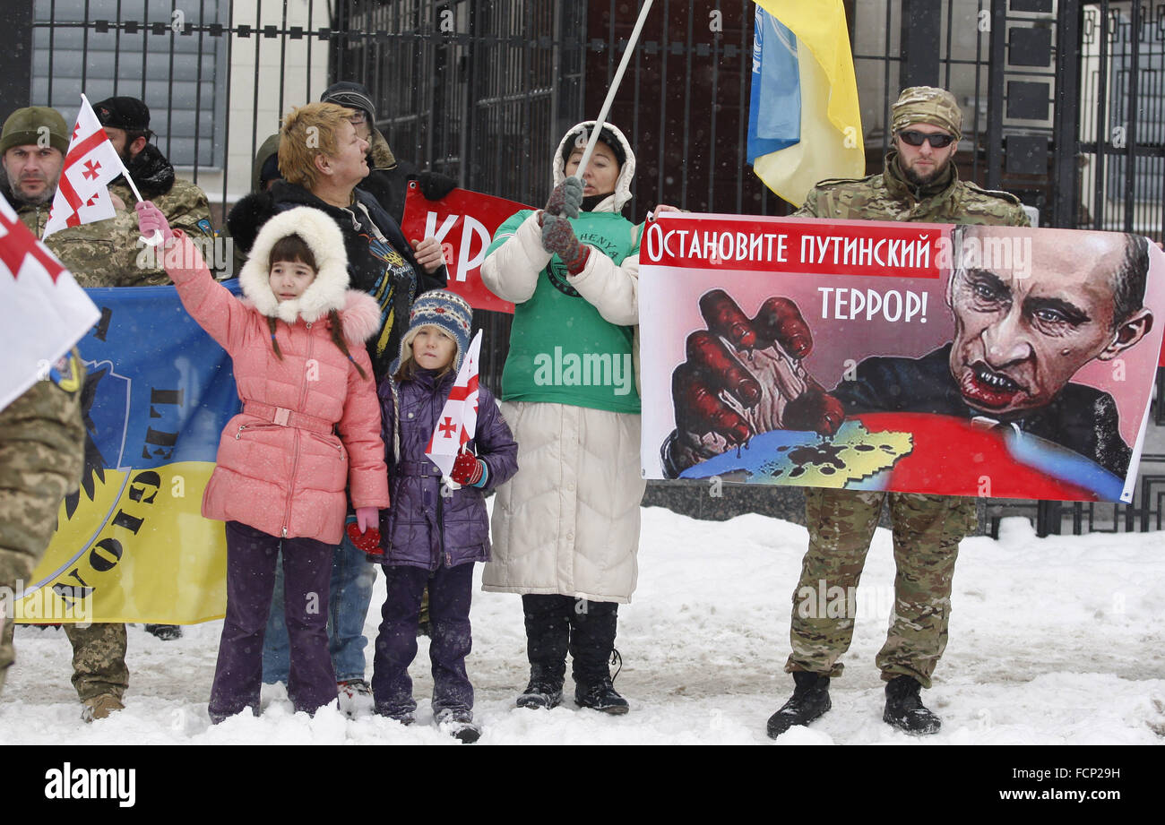 Kiev, Ukraine. 23rd Jan, 2016. Activists from Ukrainian voluntary battalions 'Georgia national legion' Chechen battalion named of Dzhokhar Dudayev, and their supporters during protest against the politics of Russian President Vladimir Putin, in front the Russian Embassy.The inscription on the placard reading 'Stop Putin's terror!' © Vasyl Shevchenko/Pacific Press/Alamy Live News Stock Photo