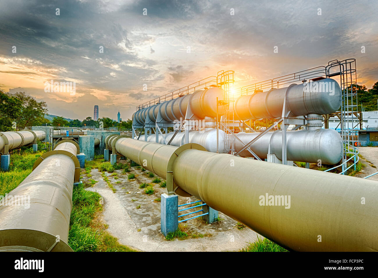 Oil and gas industry refinery factory at sunset, petrochemical plant ...