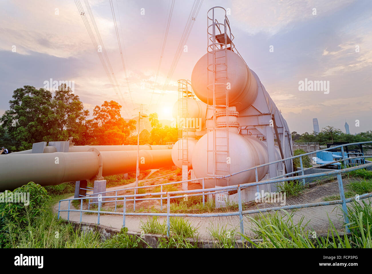 Oil and gas industry refinery factory at sunset, petrochemical plant ...